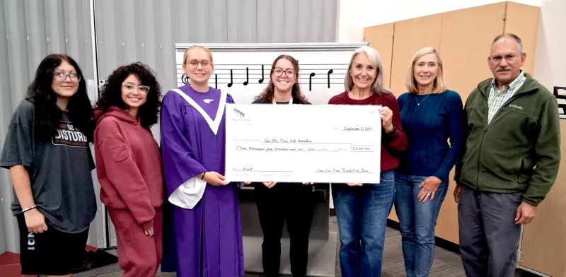 NUAF donates funds for NUHS choir robes